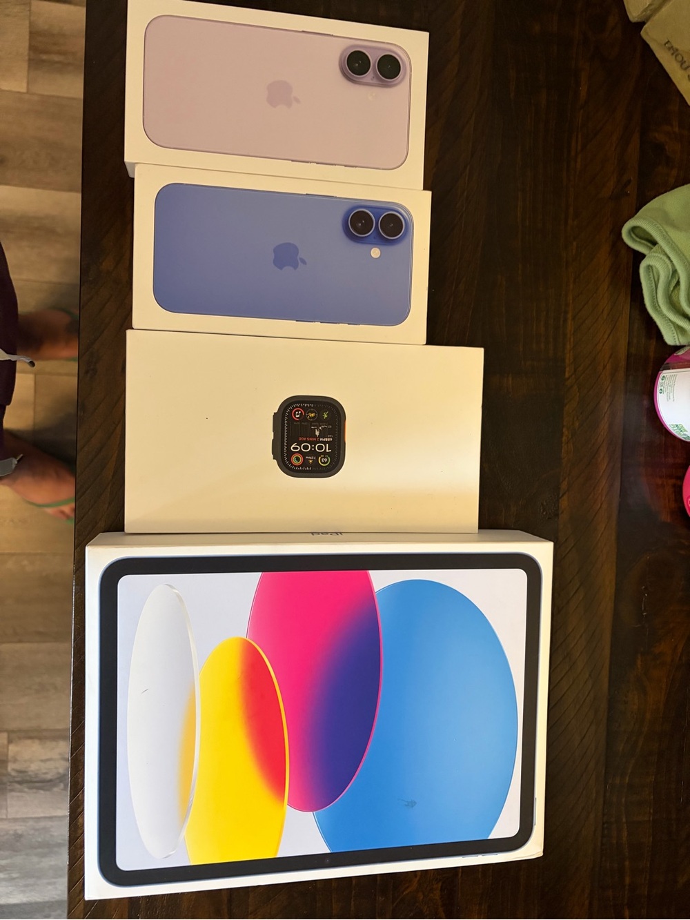 Apple empty boxes in Lavender and Blue with Apple Watch and iPad empty boxes.